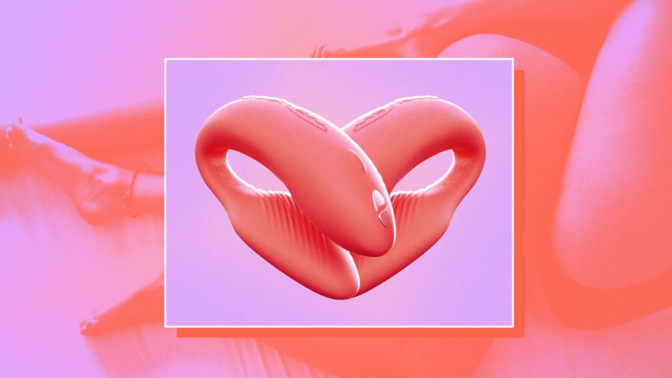 Two We-Vibe vibrators shaped into a heart on a purple and pink background.