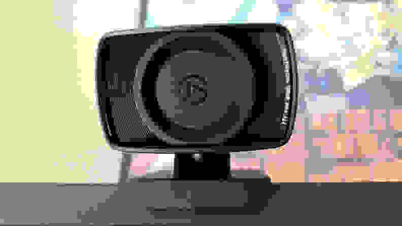 A straight on view of a webcam with a lens cover