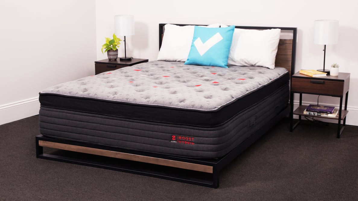 The Zoma Boost Hybrid mattress in a bedroom.