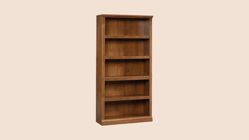 Angled front view of a Sauder 5-Shelf Bookcase with oil-oaked brown finish.