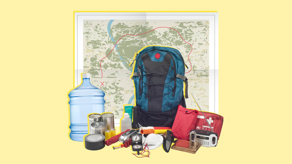 Emergency preparedness items like a backpack, a first aid kit, a radio with antenna, a jug of fresh water, masks, tins cans of food, a geographic map and a flashlight.