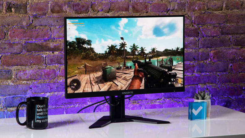 Looking at the 24 inch G24f 2, the best gaming monitor for the price, against a brick wall with Far Cry on screen