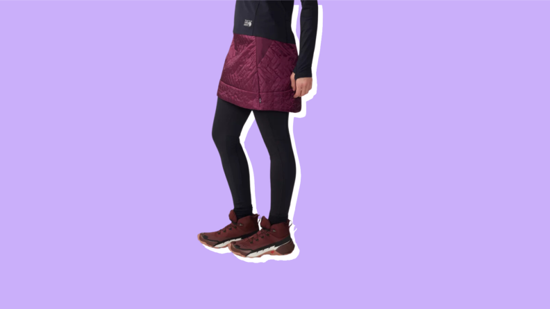 A model wears a maroon puffer skirt.