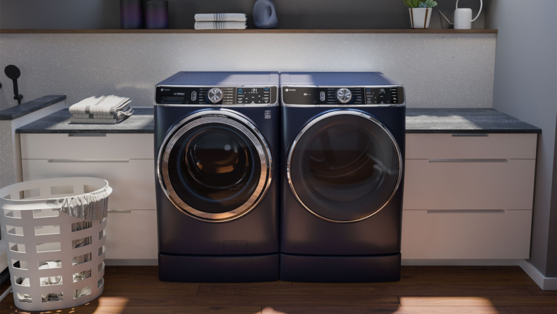The sapphire blue GE Profile PFW870SPVRS and matching dryer in a laundry room.