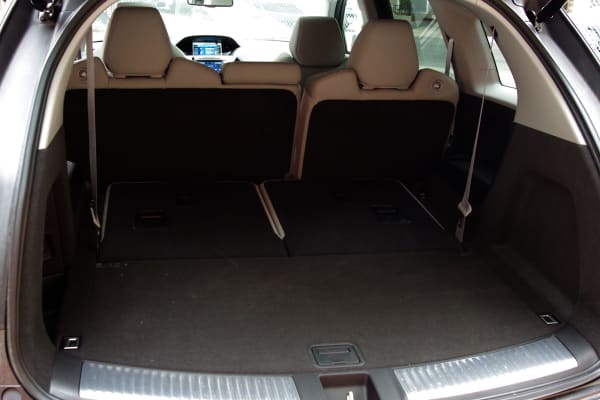 The 2014 Acura MDX's rear cargo area with the third row folded down.