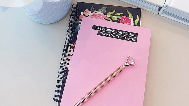 A pink notepad that says "First I drink the coffee. Then I do the things."