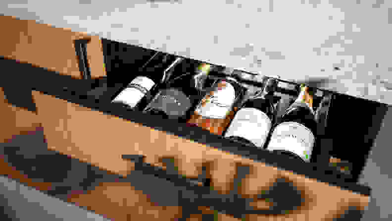 A kitchen drawer opens to reveal wine storage for five bottles.