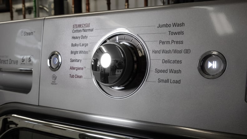 Close-up of the cycle selection dial of the LG WM8100HVA front-load washer.