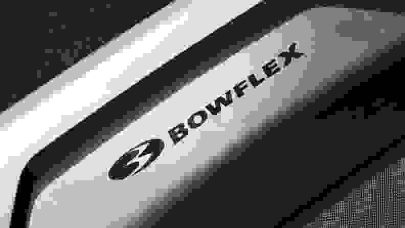 A closeup of the Bowflex logo on the Bowflex BXT8J.