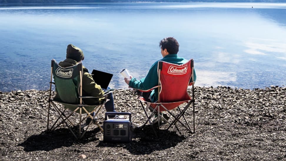 Couple using the Bluetti AC60 at a lake.