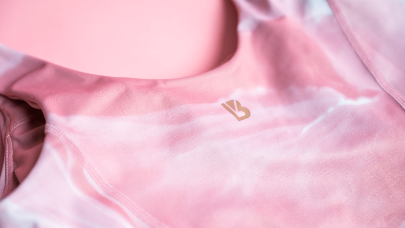 A pink Buffbunny crop top with the logo visible on a pink background.