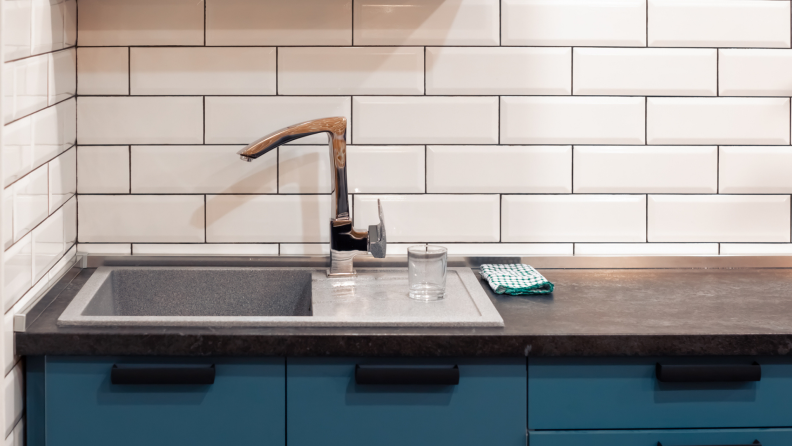 Close up of a kitchen backsplash with subway tile.