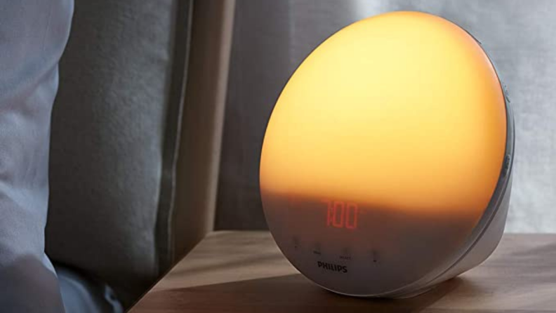 A sunrise alarm on a nightstand