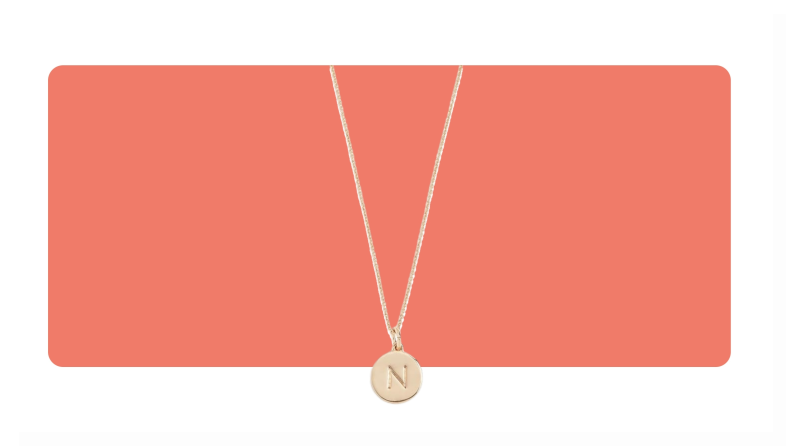 A gold Kate Spade Alphabet Pendant necklace with the letter "N" on the pendant.