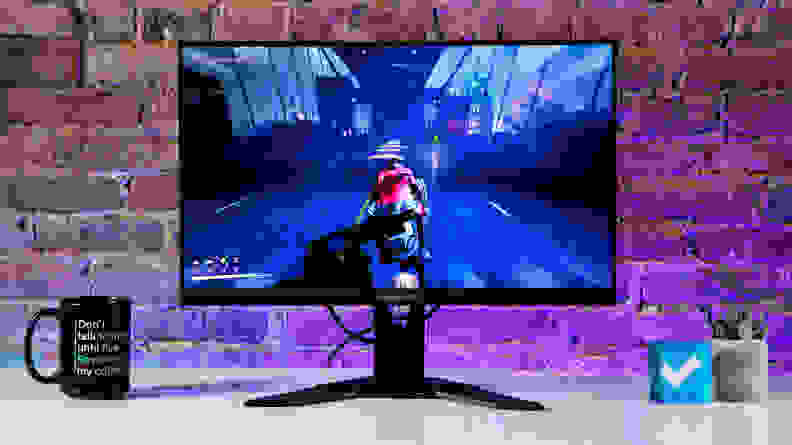 The monitor displaying the video game 'Gotham Knights.'