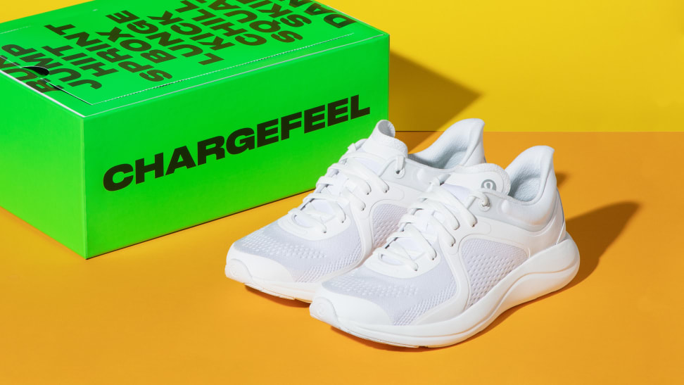 White Lululemon Chargefeel sneakers next to a green Chargefeel box