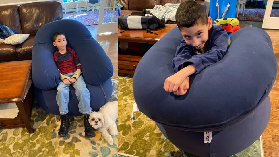 Boy lounges on a Yogibo bean bag.