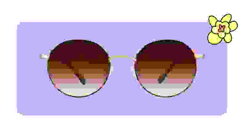 Round amber tinted zenni sunglasses on a purple background