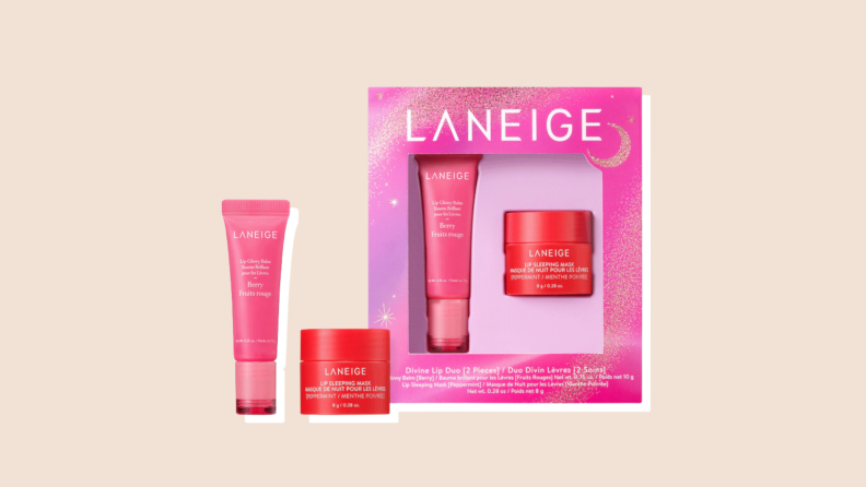 A pink box of Divine Lip Tuo by Laneige sits next to Laneige's Berry Fruits rouge and Lip Sleeping Mask.