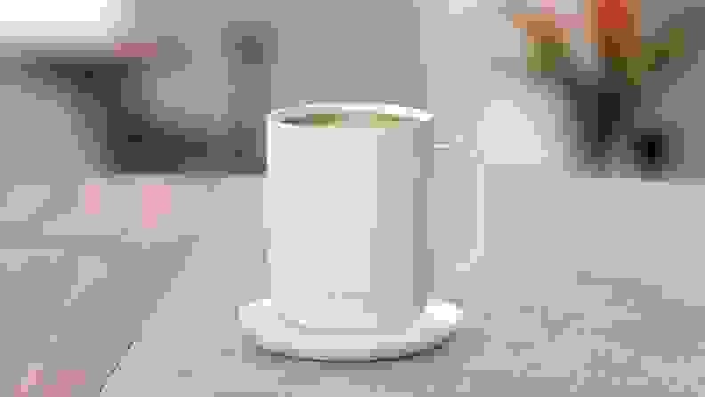 A whit coffee mug on a table.
