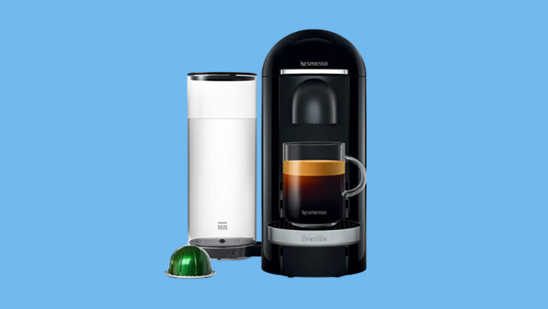 Nespresso machine against blue background