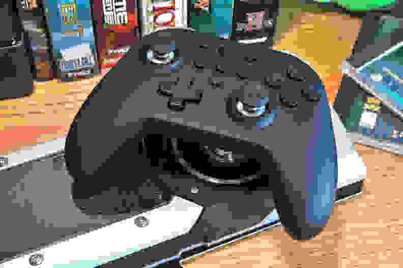 Looking at a black controller with nintendo switch layout on top of a nvidia graphics card