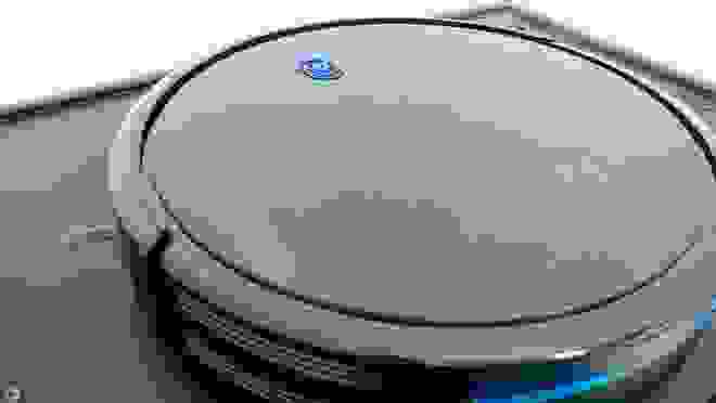 Close up of a Eufy 11S robot vacuum.