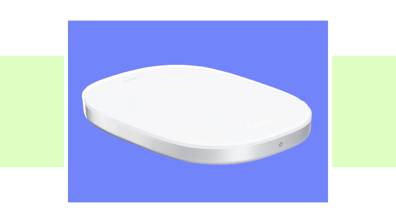 An image of a flat, thin white kitchen scale.
