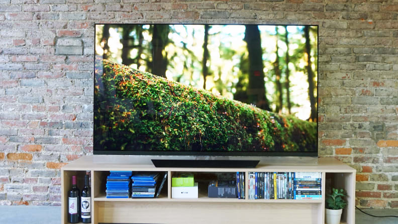 An OLED TV on a TV stand