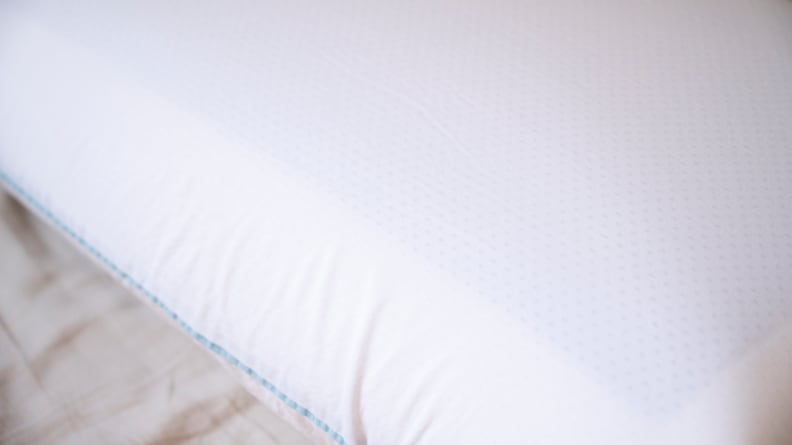 the surface of the tempur-cloud dual breeze pillow with visible cooling gel beneath the cotton surface