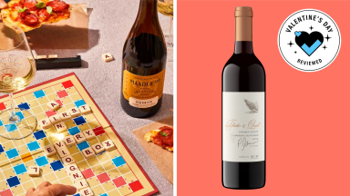 A Valentine's Day collage with a bottle of wine from Firstleaf and a Scrabble game background.