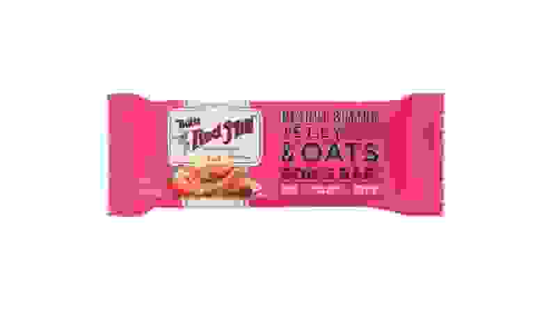 A peanut butter and jelly-flavored granola bar wrapped in a bright pink wrapper.