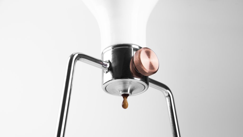 An up close look at the funnel and its valve of a Gina coffee maker.