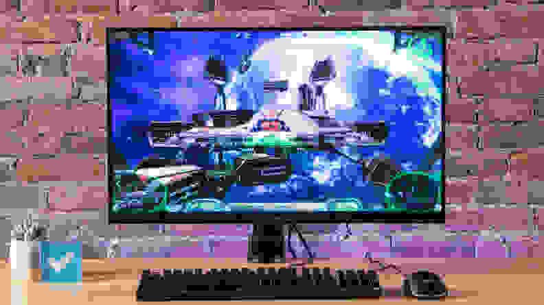 The Gigabyte M28U sitting on a table featuring an outer space video game on the screen.