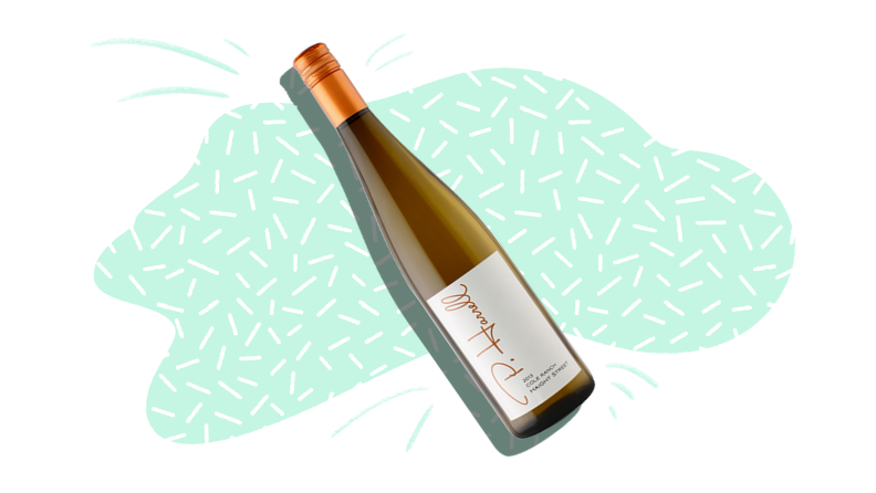 A silhouetted bottle of white wine wine on a mint and white patterned background.