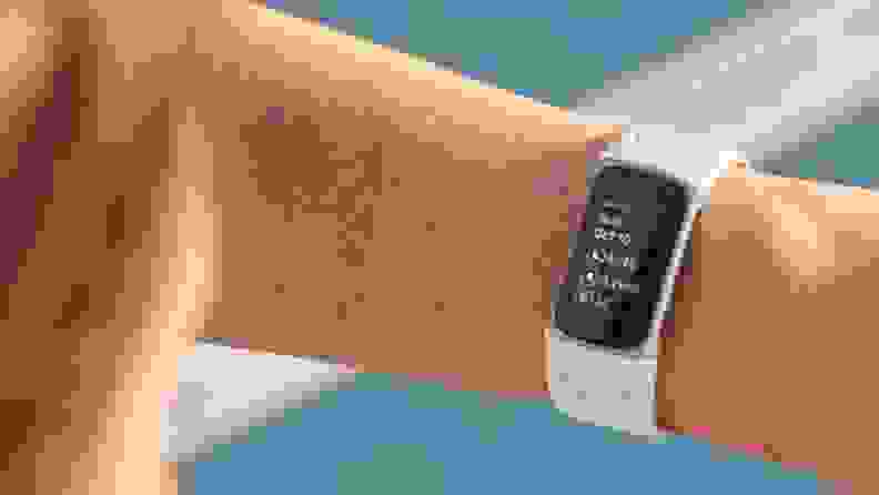A person wears the Fitbit Charge 5 on their wrist