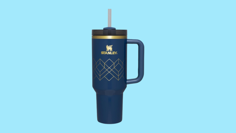 Dark blue Stanley cup against blue background