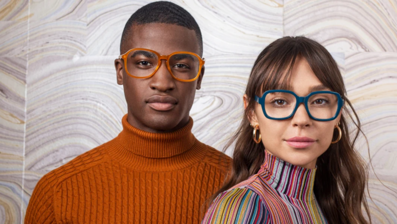 An image of two people wearing retro-style glasses.