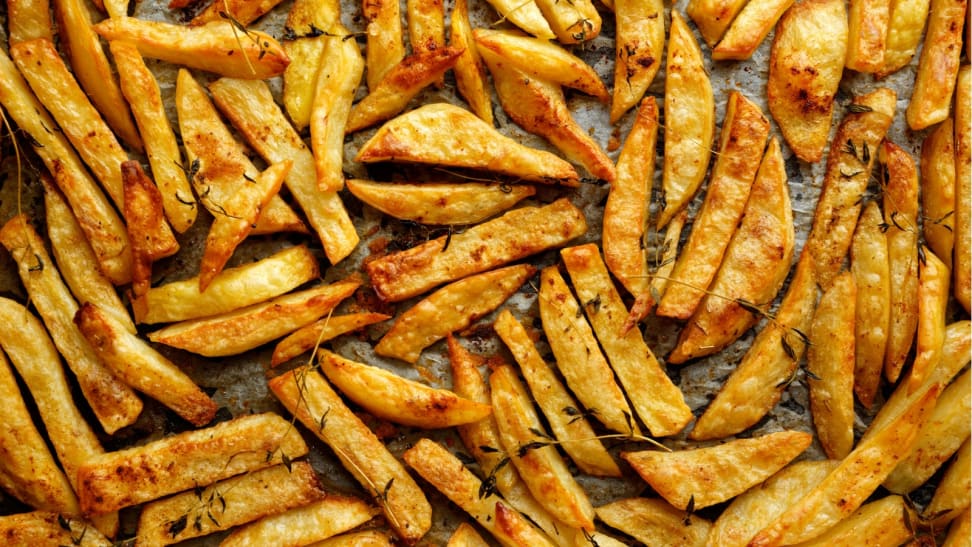 Air fried French fries on a sheet pan.