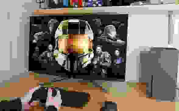 A 4K monitor being used with an Xbox Series X sits on a desk.