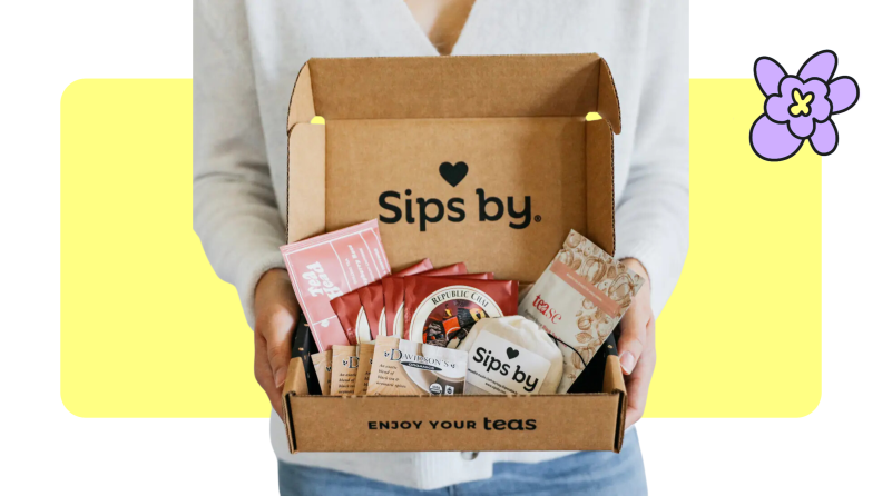 woman holding Sips by Tea Club Subscriptions box