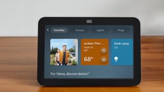 A black Amazon Echo Show 8 sits on a table.