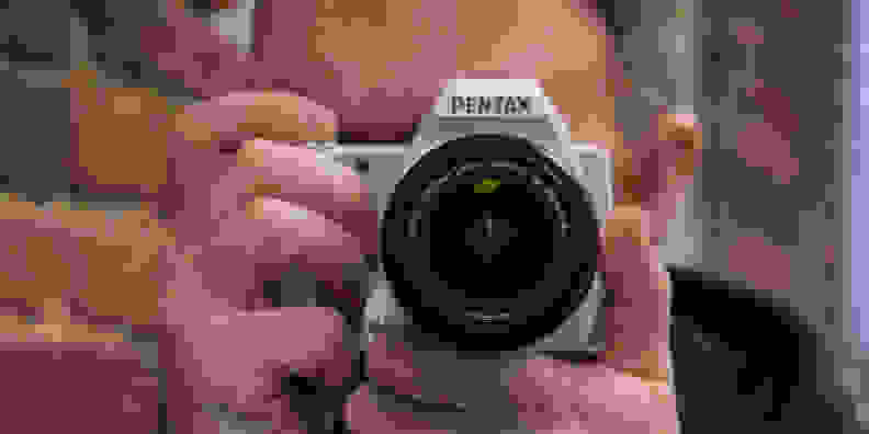 A photograph of the Pentax K-S1 in use.