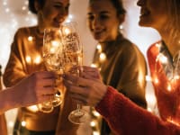 Group of friends toasting with champagne flutes.