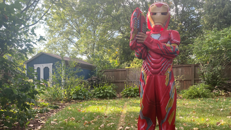 A boy dressed up in an Ironman costume