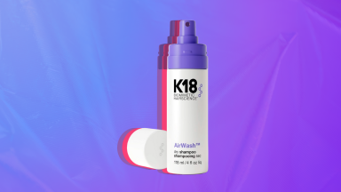 Photo of the K18 Aitwash Dry Shampoo against a blue and purple background.