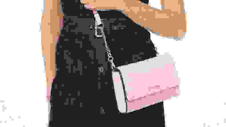 woman wearing pink Michael Kors crossbody