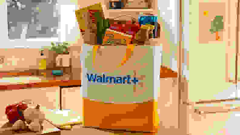 A Walmart+ grocery bag in a kitchen.