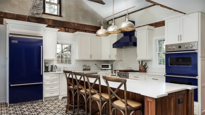 Cobalt blue appliances in a white kitchen