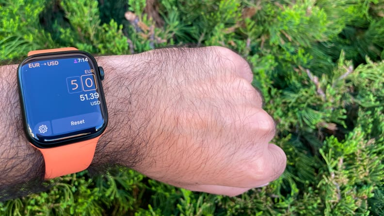 A person checks an Apple Watch fastened to their wrist featuring the Elk app.